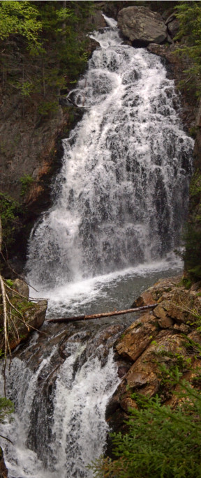 [Two images stitched vertically to cover both the upper and lower parts of the cascades. The upper portion is much taller and wider than the lower portion. In between the two is a pool. The lower portion goes to the left after the upper portion falls into the pool.]